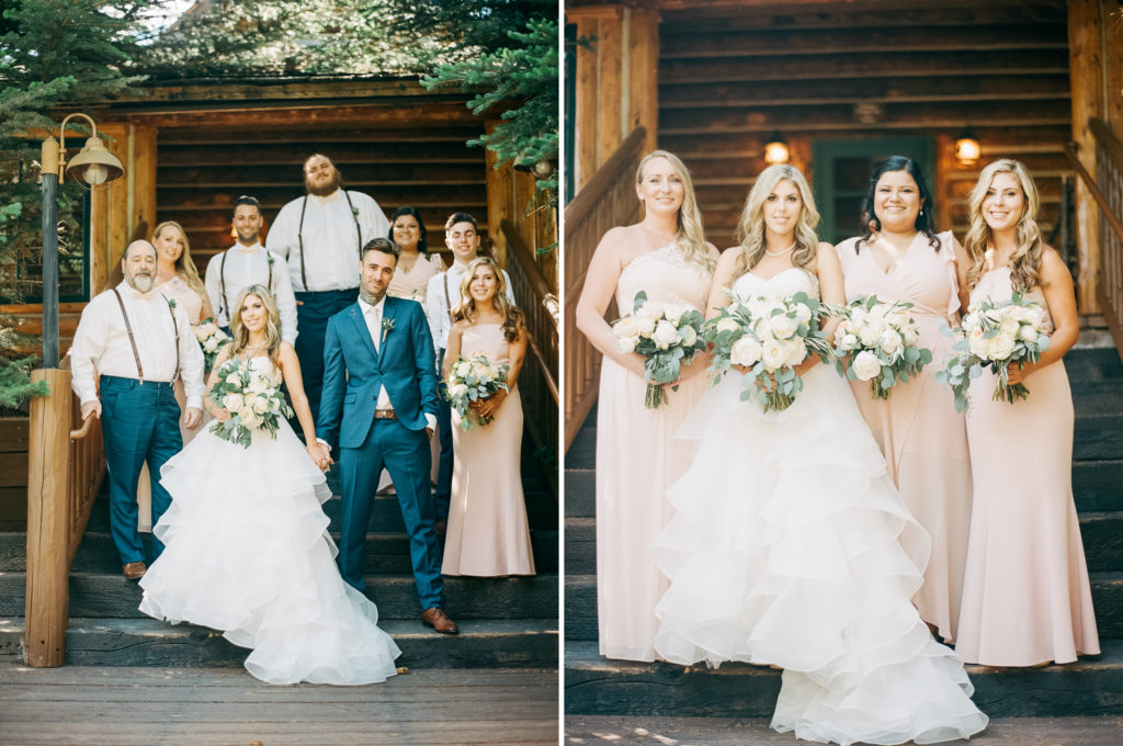 At the Trail Creek Cabin wedding, the bride and groom smile with their wedding party.