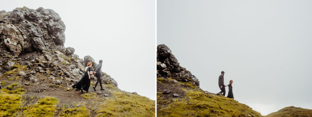 A couple walk together on a rocky outcrop on the Isle of Skye.