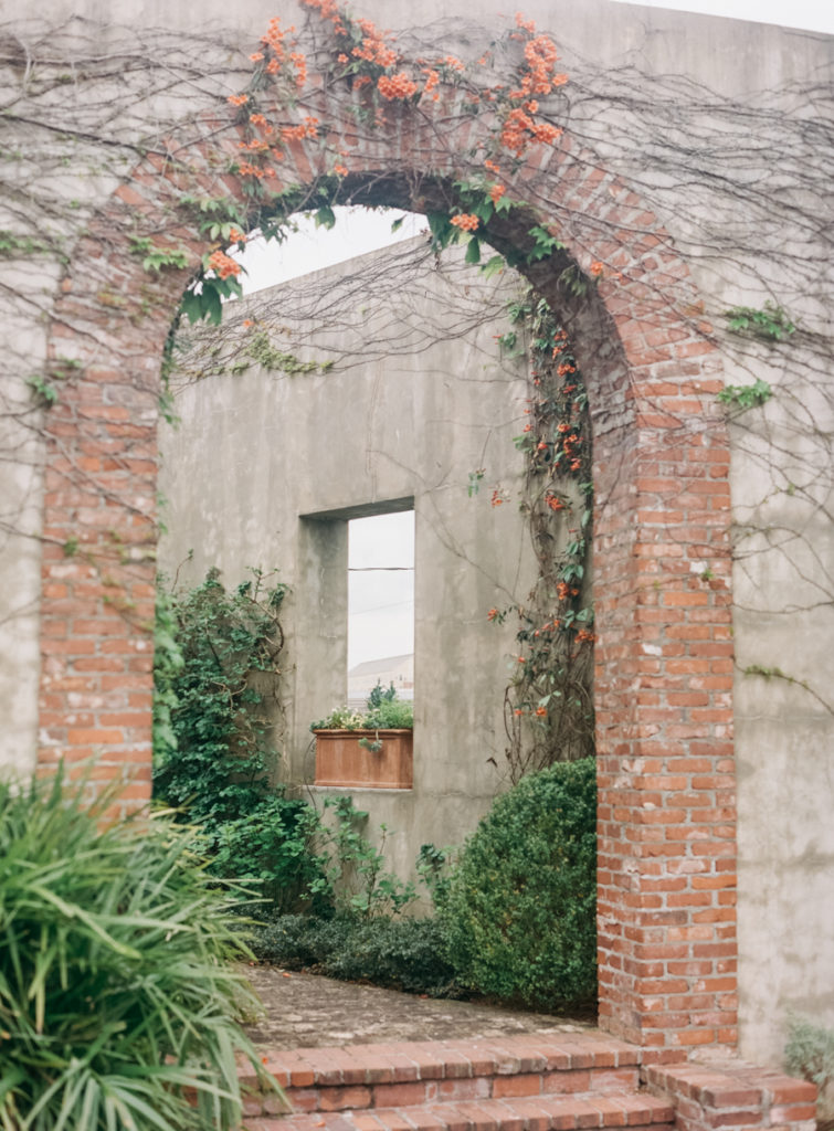 A brick doorway covered in ivy at an outdoor wedding venue in Atlanta.
