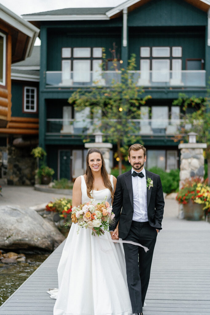 couple posing on dock of shore lodge wedding venue McCall Idaho